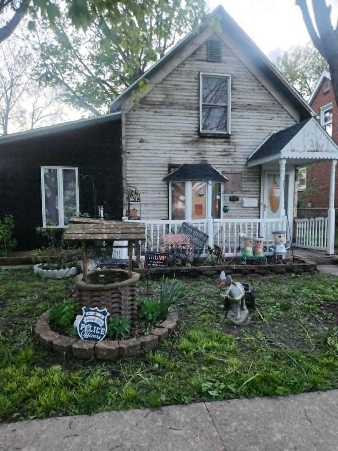 Before — deteriorated white siding
